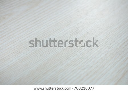 a white surface under a wooden Board