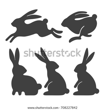 Rabbit set. Stylized silhouettes of sitting and running rabbits, isolated on white background. Vector illustration.