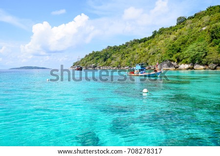 The little boat on blue sea at Similan island, are located in the Andaman Sea on the West Coast of Southern Thailand.