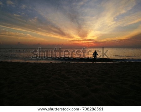 Tranquility and nice sunrise scenery at sandy beach. Selective focus on the horizontal background.