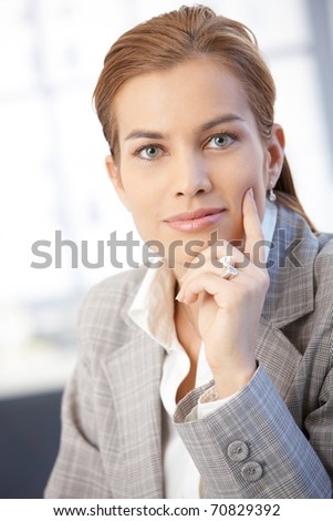 Portrait of attractive young businesswoman smiling in office.?