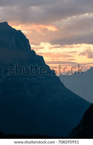 Rising Sun Behind the Mountains at Glacier National Park