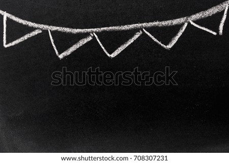 White chalk drawing as  party flag on black board background with copy space for decoration or add text