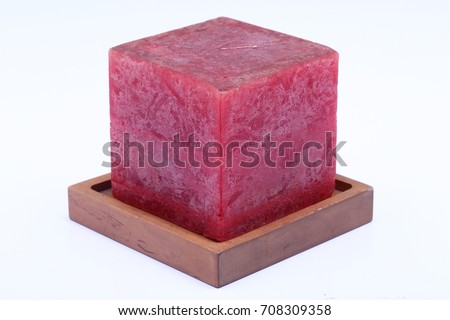 Cube Square Red Marble Candle on Teak Wood stand, studio lighting white background isolated