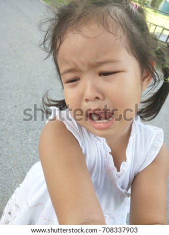 Asian girl crying.