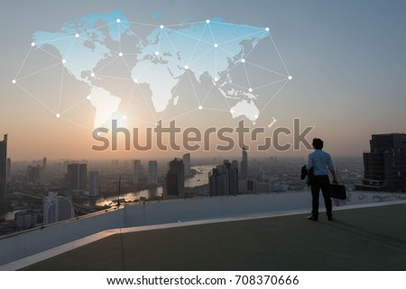 Businessman stand on roof top of building,  globalization conceptual