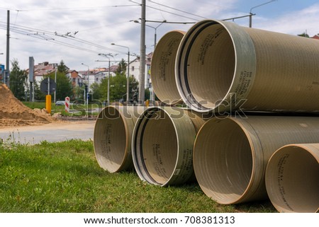 Big plastic tubes on road works, horizontal, no people