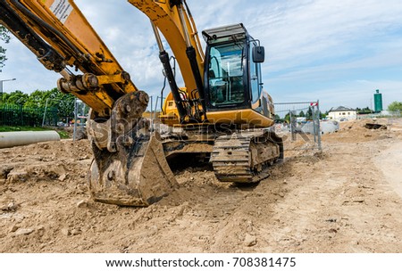 Excavator on road works, horizontal