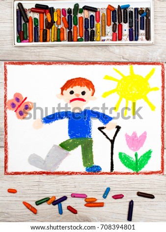 Photo of colorful drawing: Sad boy with broken leg