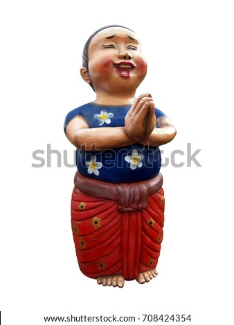 boy wear traditional costume smiling and put hands together in respect for greeting hello in thai style, thai called sawasdee, baked clay doll for garden decoration or home decor 
