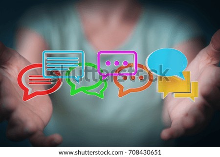 Businesswoman on blurred background using digital colorful 3D rendering conversation icons
