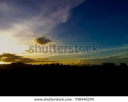 silhouette city scape with sky scape are plenty of copy space. gold light of sunshine and cloud scape are the beginning day.