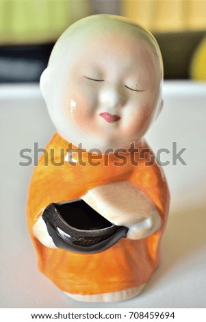 Monk ceramic statue. 