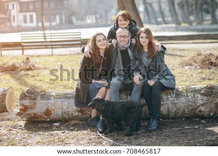 happy family in the sunny park together