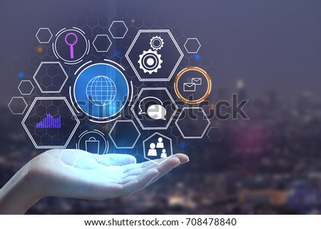 Hands holding abstract glowing tech business hologram on dark city background. Future concept. 3D Rendering 
