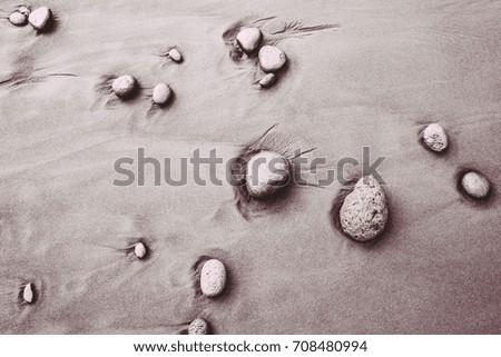 Sand and stones  as the background image with wave shaped structure.
