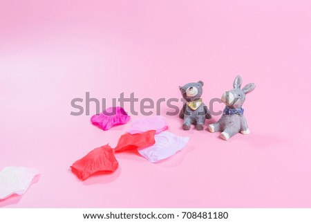 Pink background bear, little donkey and petals