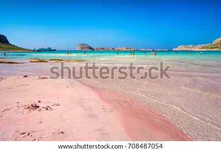 Amazing view of Balos Lagoon with magical turquoise waters, lagoons, tropical beaches of pure white and pink sand and Gramvousa island on Crete, Greece Royalty-Free Stock Photo #708487054