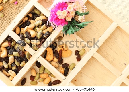 Top view on square wood box space with mixed nut