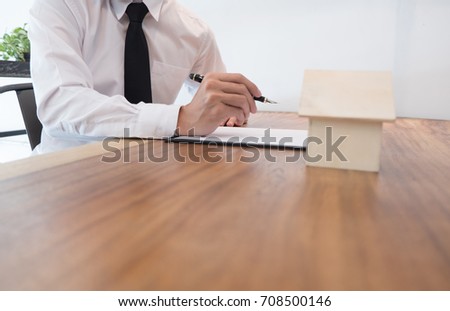 Business man signing contract making a deal with  real estate agent Concept for consultant