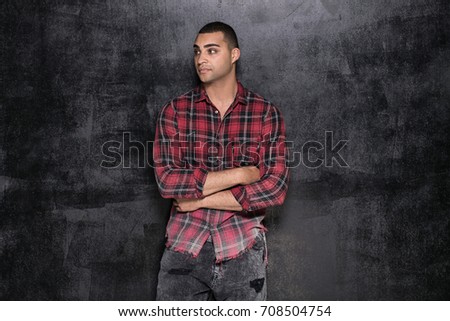 Photo of young handsome african american man in checkered shirt.