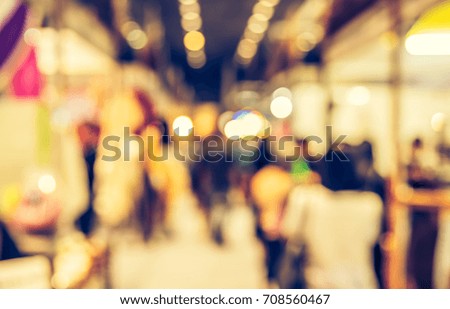 Abstract blur Shopping mall or Exhibition hall with bokeh for background usage . (vintage tone)