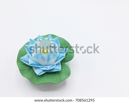Blue artificial lotus on white background