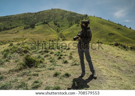 Young man asian photographers with  shoot photo nature