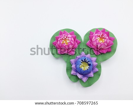 Pink and purple artificial lotus on white background