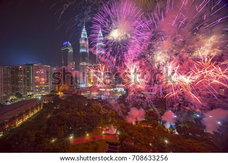 Fireworks display show over Kuala Lumpur city skyline Royalty-Free Stock Photo #708633256