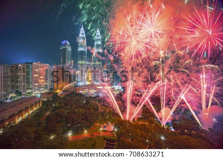 Fireworks display show over Kuala Lumpur city skyline Royalty-Free Stock Photo #708633271