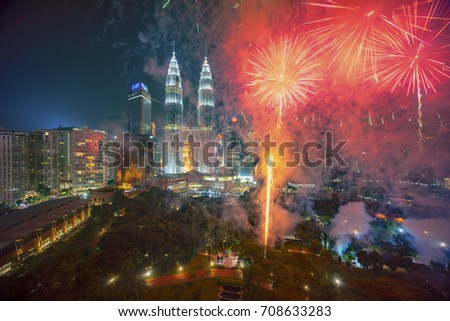 Fireworks display show over Kuala Lumpur city skyline Royalty-Free Stock Photo #708633283
