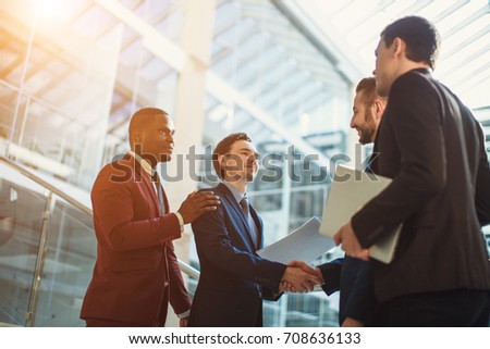 Business people shaking hands, finishing up a meeting Royalty-Free Stock Photo #708636133