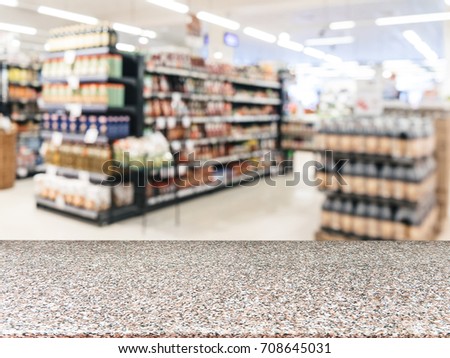 Marble board empty table in front of blurred background. Perspective table over blur in supermarket - can be used for display or montage your products. Mockup for display of product.