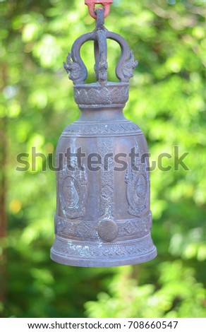 Single temple bell with green natural.