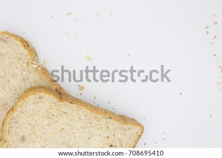 Top view of sliced bread or cut white background, Free space for text, Beautiful sliced bread and scattered crumbs isolated on white background