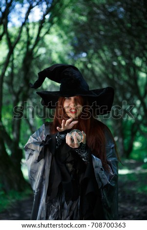 Image of witch in long black hat