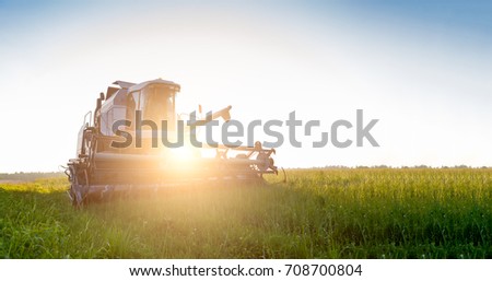 Image of combine harvester in field