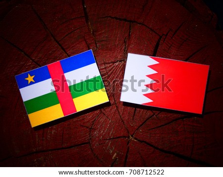 Central African Republic flag with Bahraini flag on a tree stump isolated