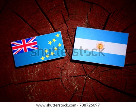 Tuvalu flag with Argentinian flag on a tree stump isolated