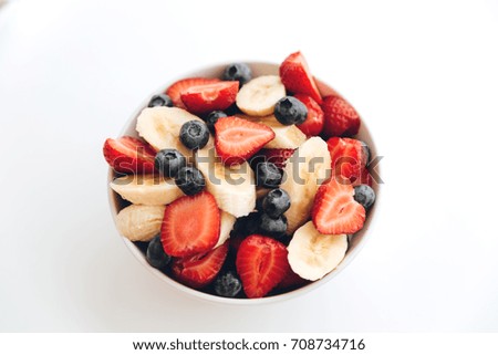 Picture of fruit salad on white background table indoors