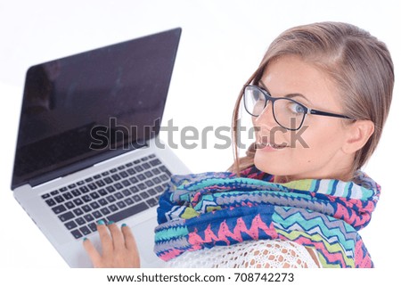 Smiling teenager with laptop on white background. Student.