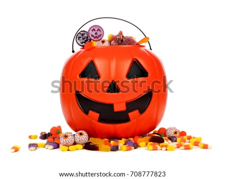 Halloween Jack o Lantern candy collector with scattered candy over a white background