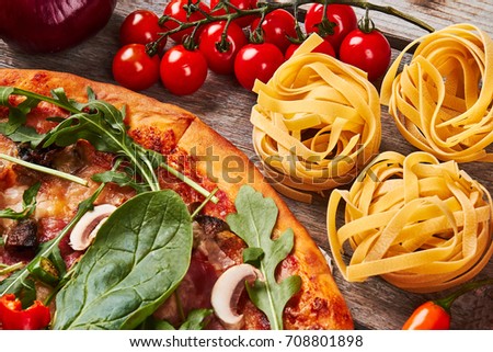 Part of pizza, cherrytomato, tagliatelle. Amazing picture of italian food.