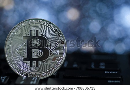 Photo of Silver bitcoin (new virtual currency) with Bokeh as a background .