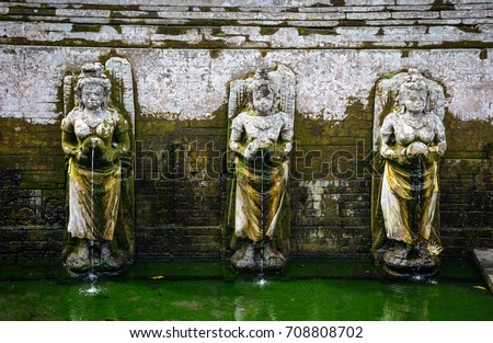 God statues at the Elephant Cave Temple in Bali, Indonesia. Bali is the most popular island holiday destination in the Indonesian archipelago.