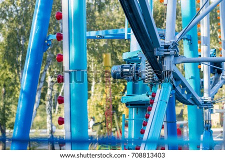 metal structures of the attraction Ferris wheel in the park. the picture is taken at a height