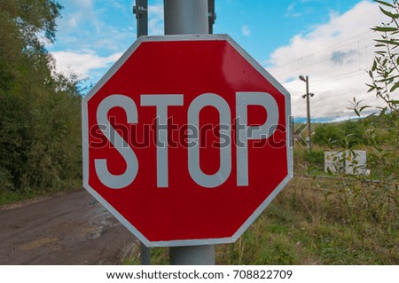 Stop sign at the railroad.