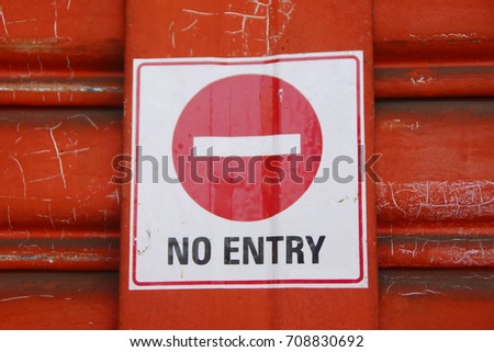 NO ENTRY Sticker Sign On Orange Shutter Door
