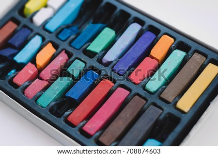 multicolored chalks in a box close up